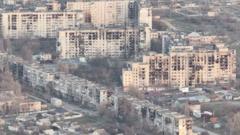Risking their lives to find food and water in Russian-occupied city